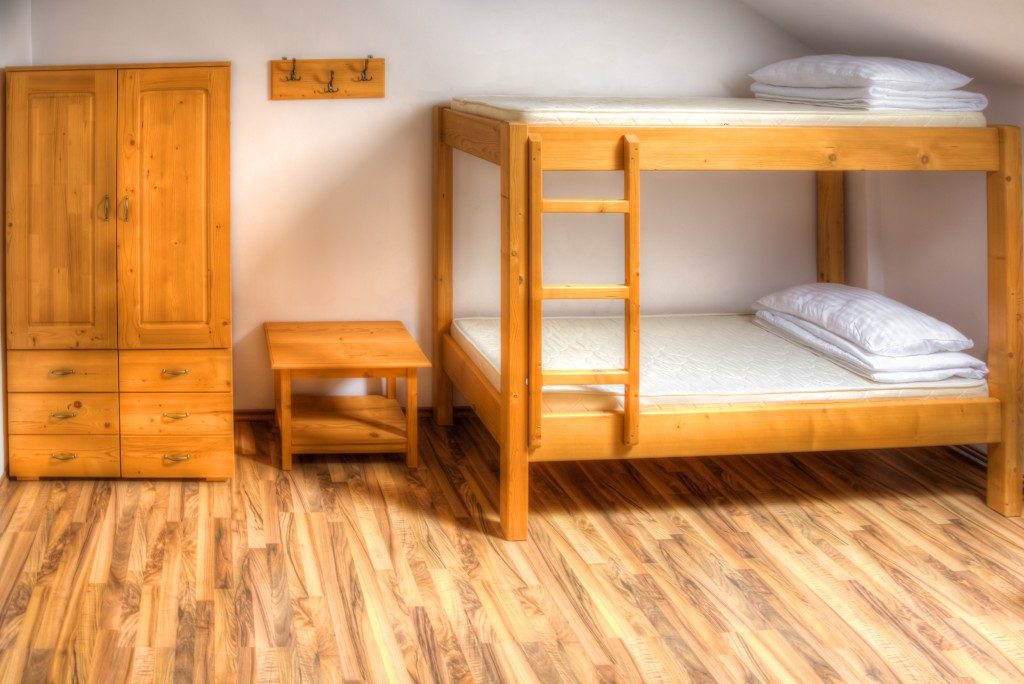 college dorm with wooden bunk beds