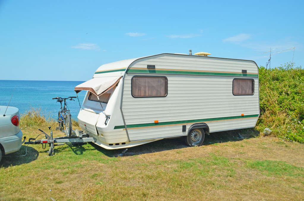 caravan trailer on sea holiday against beautiful background